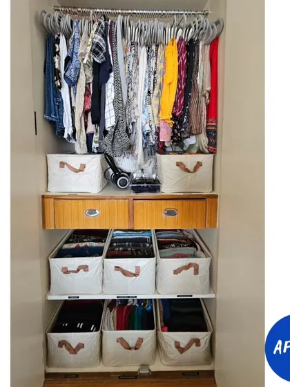 The "after" is what it's all about. By using the hanging space optimally and containing folded items in uniform bins, we created a wardrobe that is not only beautiful but incredibly functional.