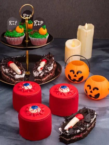 A spooky and fun Halloween dessert spread. We styled these themed pastries, from eyeball cakes to coffin-shaped brownies, to create a wicked and playful scene for a seasonal shoot.