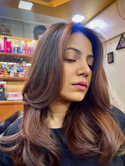 Another beautiful angle of the caramel balayage, showing the face-framing highlights and the healthy shine of the hair.
