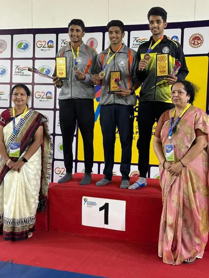 The team event podium at the All India School Games, celebrating the gold medal win.
