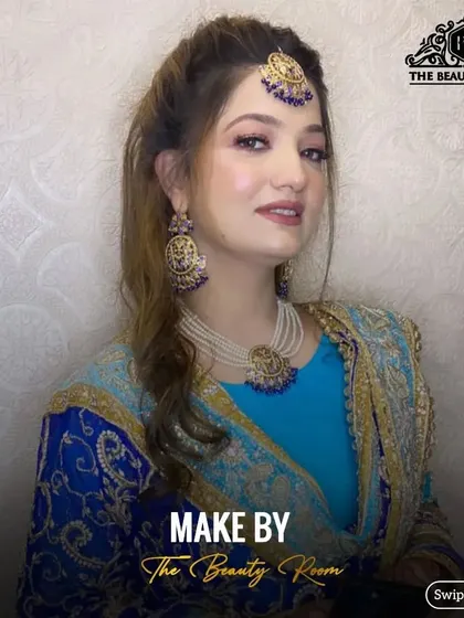 A beautiful party look with blue accents. I matched the eyeshadow and jewellery to her stunning blue and gold outfit.