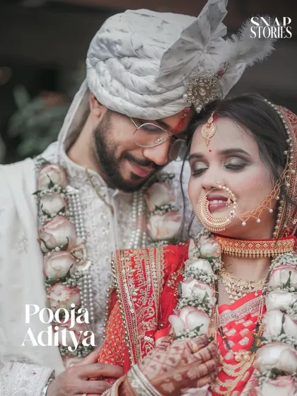 A close-up portrait of the couple, showcasing the bride's stunning nath and intricate jewelry. We specialize in detailed shots that highlight your bridal look.