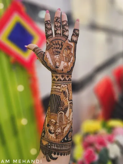 A full bridal arm design with multiple story panels. This piece includes portraits of Radha-Krishna and a doli scene, creating a beautiful narrative from wrist to elbow.