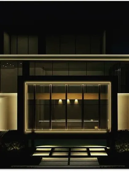 This is a lighting visualization for the Silver Oak clubhouse, a key amenity for the community. The design uses clean, horizontal lines of light to give the building a sleek, modern, and inviting presence at night.