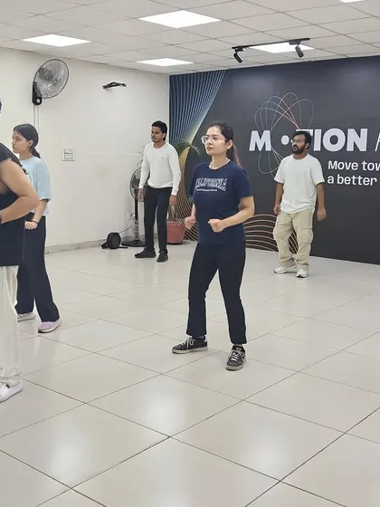 A snapshot of our adult class in action. Everyone is focused, in sync, and learning the choreography together.