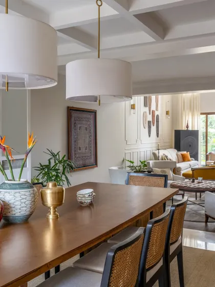 The dining space of the Rio Home, as seen from the living area. The open layout creates a sense of grandeur and fluidity, perfect for a home that loves to entertain.