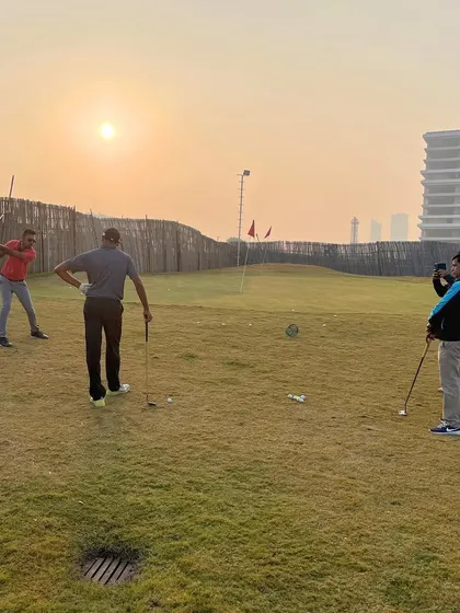 Golfers practice their chipping and putting as the sun sets. Our short game area provides a realistic environment to work on the finer points of your game.