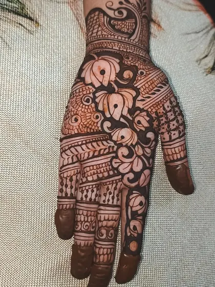 A still photo of the intricate lotus design, showing the detail and precision of the line work. This is a classic and timeless choice for any occasion.