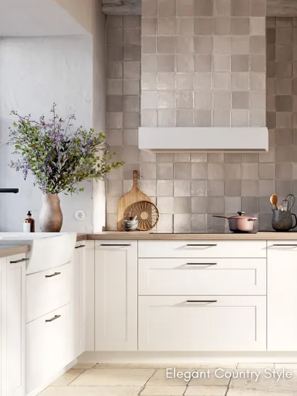 The concept130 RAVENNA White kitchen, featuring elegant country-style coffered fronts, a double basin sink, and a beautiful tiled backsplash.