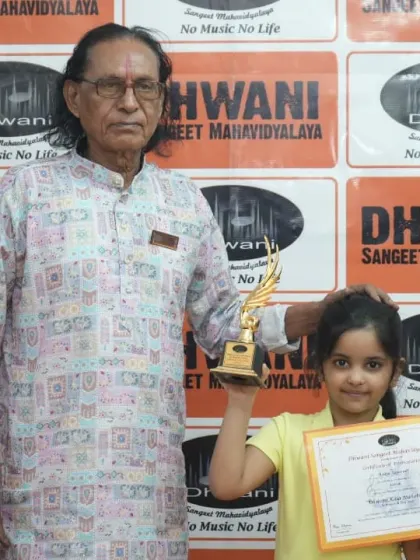 A senior guru with one of his youngest students, passing on the tradition.