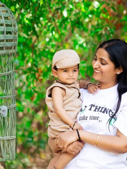A mother and her son enjoying a moment together outdoors. The natural setting and their relaxed interaction make for a beautiful and authentic family photo.