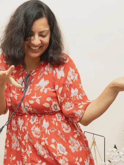 A candid shot of a guest dancing and enjoying the celebration. I capture the atmosphere of the party by photographing the joy of your guests.
