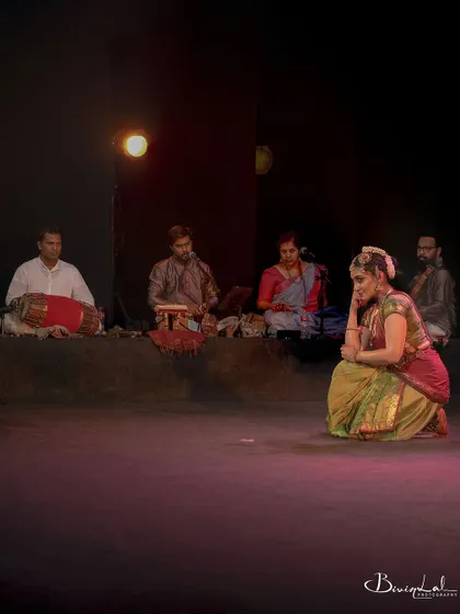 A wide shot showing the complete ensemble on stage: myself in a moment of contemplation, with my talented musicians providing the soulful score.