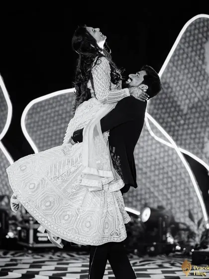 In the heart of the Sangeet, a moment of pure, weightless joy. I believe the best dance floor photos are unscripted, capturing the raw energy and connection between a couple.