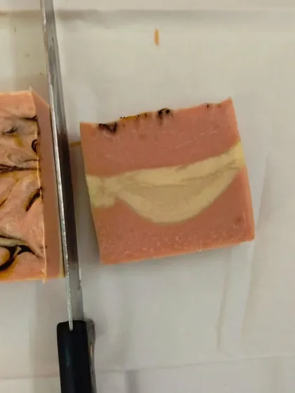 A freshly cut bar of soap, showing the beautiful swirls inside. This is a peek into my January batch making process.
