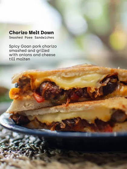 The Chorizo Melt Down from our Poee Sandwich Shop. We smashed and grilled spicy Goan pork chorizo with onions and cheese until molten, creating a perfect bite of comfort.