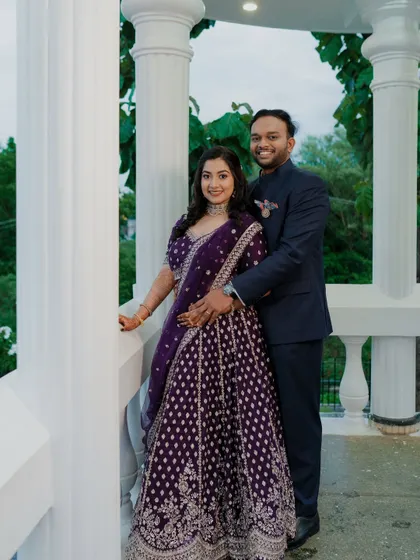 A happy couple portrait. The bride's makeup is fresh and bright, designed to look great in outdoor and indoor lighting.