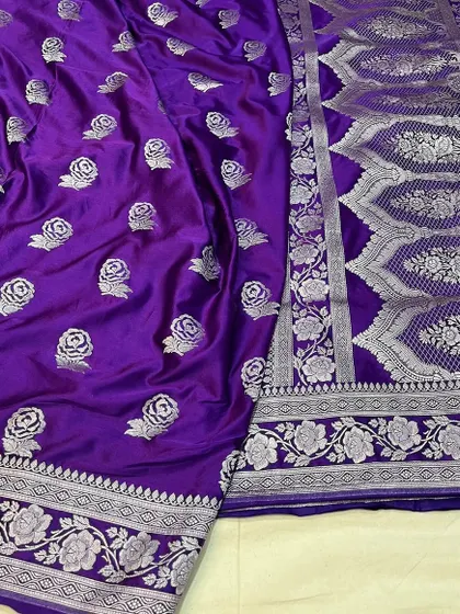 A regal purple Mashru silk saree with woven rose motifs in silver zari.
