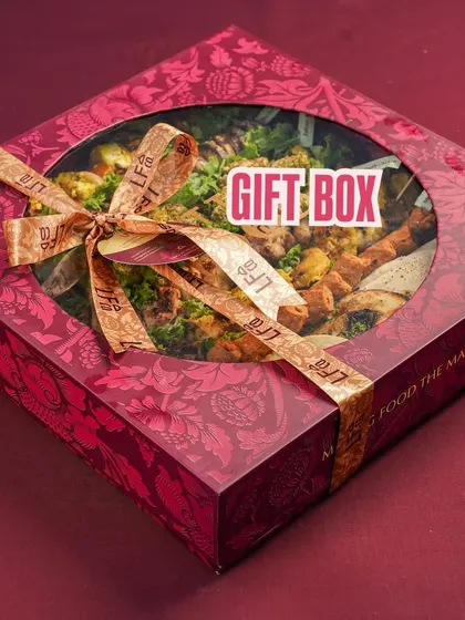 The beautiful gift packaging for my meal boxes. This one, tied with a ribbon, shows how my hampers are designed not just to taste good, but to look impressive, making them a perfect gift for any occasion.