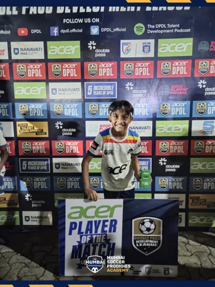 A smiling U9 player is recognized as the Player of the Match.