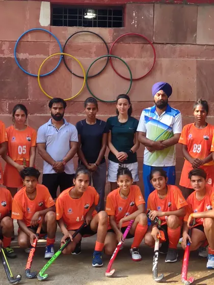 Another shot of my women's team with their coaches. The bond between players and mentors is a critical part of our academy's success.