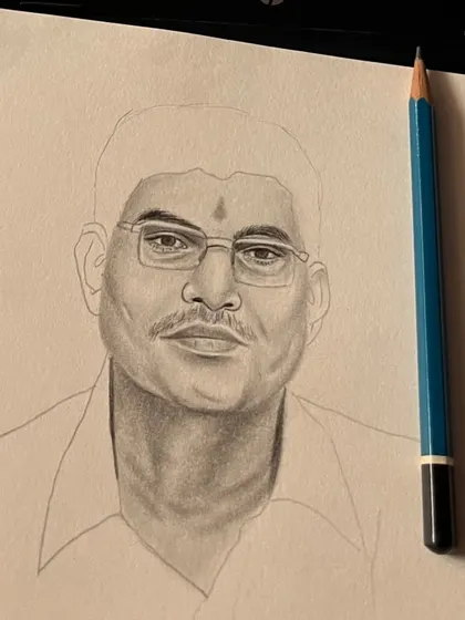 The beginning stages of the portrait, showing the man's face being shaded. This behind-the-scenes look reveals how I build up tone and likeness from a blank page.