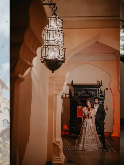 A stylish couple portrait from the Sangeet night. The grand palace corridor and beautiful lighting create a romantic and elegant atmosphere.