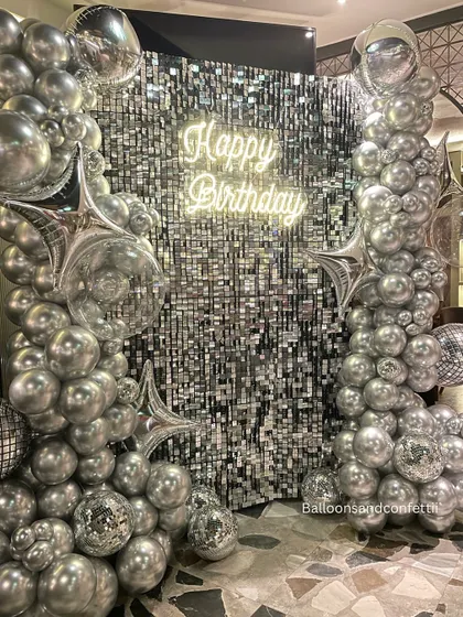 This is how we do party-varty. A full-scale glam setup featuring a silver sequin shimmer wall, custom neon sign, and a massive organic balloon garland. This isn't just a backdrop; it's the main event.