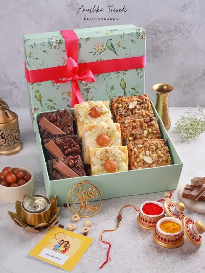 A complete Raksha Bandhan hamper with a variety of brownies, gulab jamun, and traditional roli-chawal, telling a complete festive story.