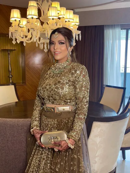 The groom's sister looks beautiful and ready to celebrate.