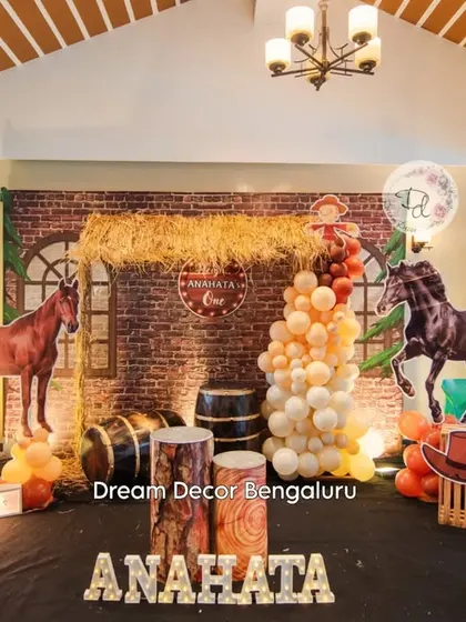 Another look at the rustic barnyard theme, showing the full stage setup with marquee letters and horse cutouts.