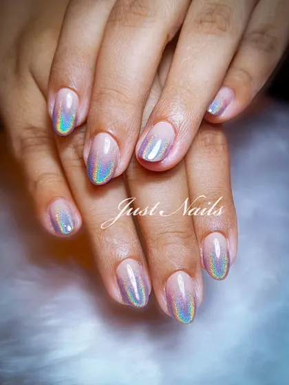 A simple yet stunning holographic ombre effect on natural-length nails.