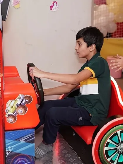 Another young racing enthusiast enjoying our arcade games.