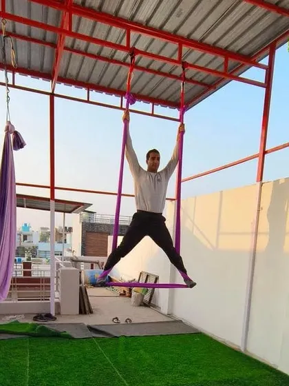 A student in a wide-legged pose, feeling the connection with the air element.