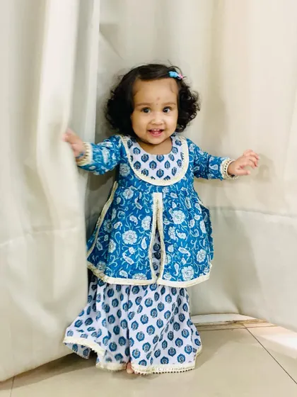 My daughter dressed up in a beautiful traditional outfit for her first Raksha Bandhan.
