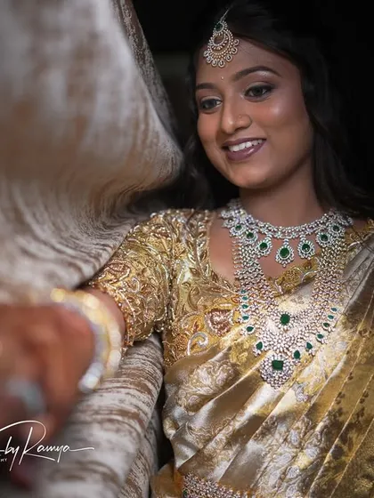 A beautiful, happy moment from Pooja's reception. Her makeup looks radiant and natural, even in a candid shot.