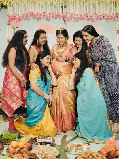 A beautiful moment of friendship and love as the mother-to-be is surrounded by her friends at her baby shower.