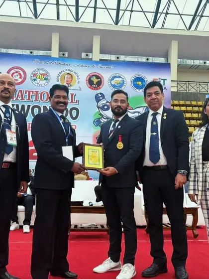 My commitment to Taekwondo has been recognized by the Taekwon-do Association of India. Here I am receiving the "Outstanding Instructor" award for my contributions to developing the sport.