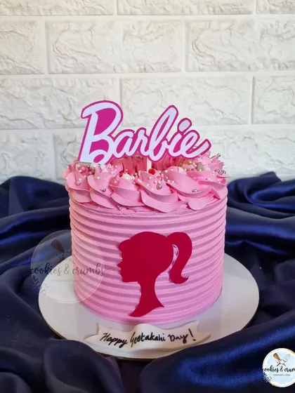 The Barbie fever is still going strong. This simple yet iconic pink cake features a textured buttercream, the Barbie logo, and a classic silhouette.