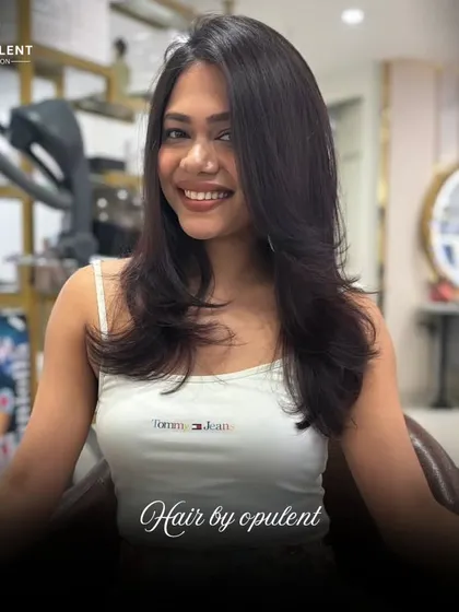 Hair by Opulent is more than just a style, it's power. This layered cut gives her hair beautiful movement and a healthy, vibrant look.