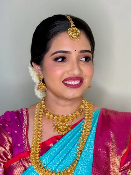 A slightly different angle of Navya's beautiful Muhurtham look, capturing her happy expression.