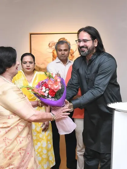 Welcoming esteemed guests with flowers at the inauguration of my exhibition. The support from the art community and patrons is what makes these shows possible and successful.