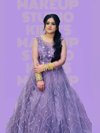 The same client from a different angle, showing off her beautiful lavender gown and elegant side-swept hair.