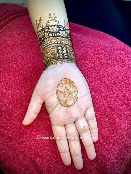 The same swan design shown on the palm before the surrounding patterns are filled in.