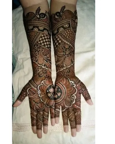 A classic design with a central mandala on the palm, surrounded by peacock and floral motifs. This symmetrical style is always a beautiful choice.