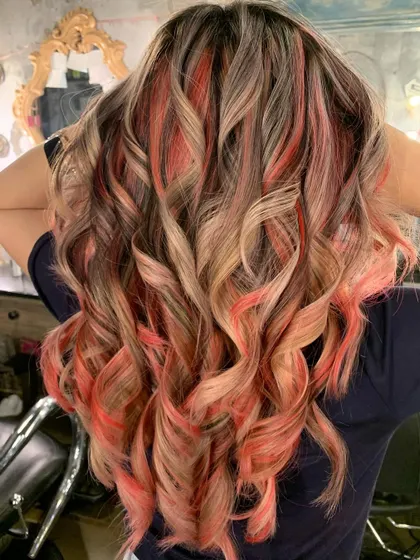 Peach fuzz perfection. This was a color correction where we used bleach and tone to create this peachy, creamy mix of colors.