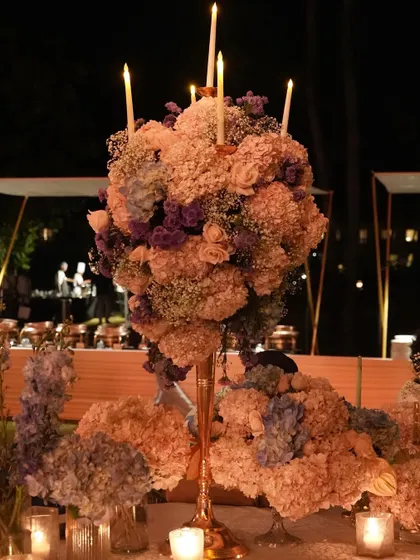 Another view of the tall, dramatic centerpiece, showcasing its full, rounded shape and the beautiful blend of pastel colors. This type of arrangement is perfect for creating a focal point in a large space.