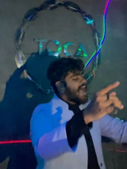 A photo of me pointing at the crowd, fully engaged and directing the party.