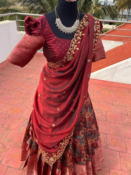 The rich maroon color is perfect for a wedding or traditional ceremony.