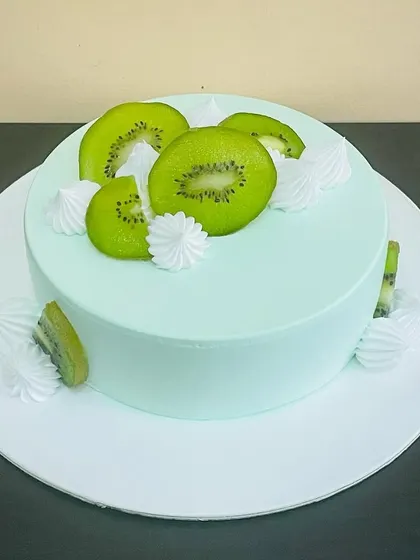 A close-up of our fresh Kiwi Cake, highlighting the vibrant green fruit slices.